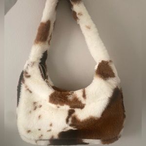Brown cow print print purse.